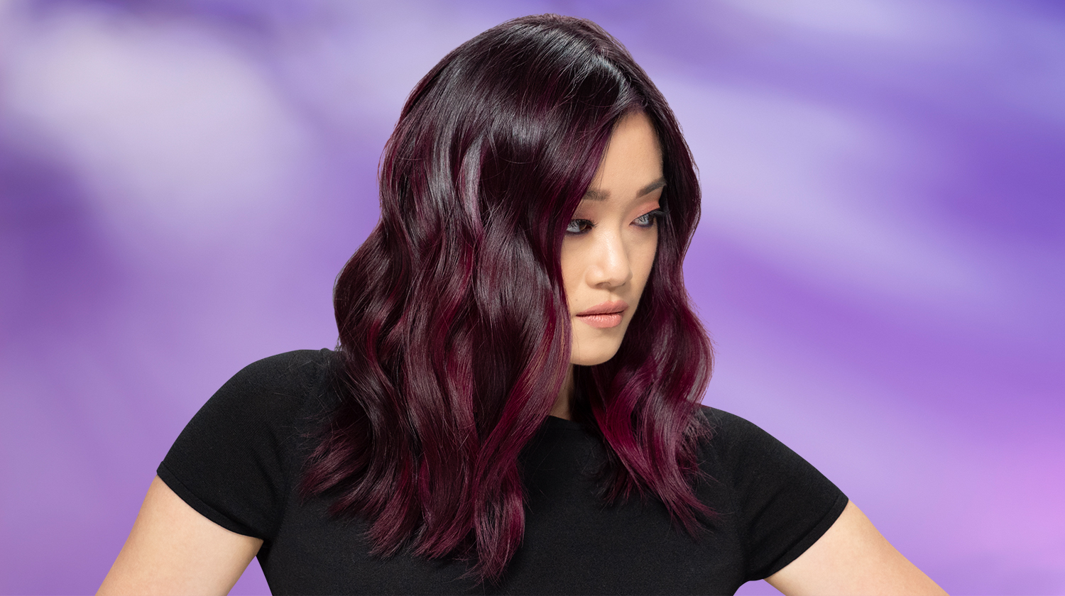a picture of a female with dark red violet hair